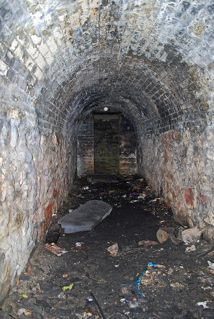 A mine tunnel (adit) cut into the cliff face at Cligga Head.