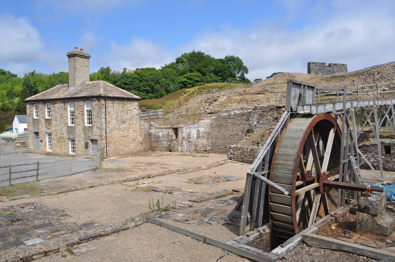 The assay house and a reconstructed waterwheel at the Nenthead smelt mill site.